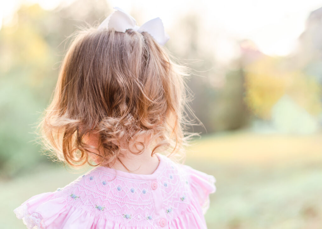 light and airy photography toddler in pink