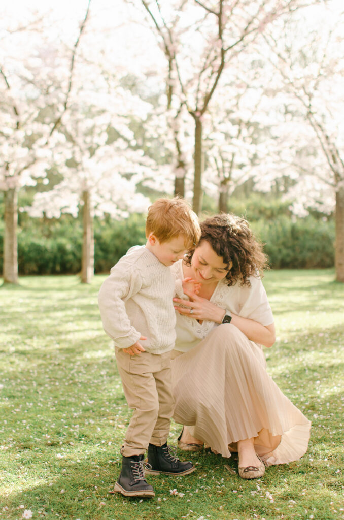 Mother and son share a moment together looking at the delicate florals.