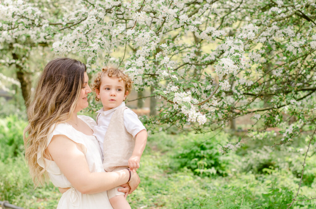 mother and son in bos en lommer during spring photos
