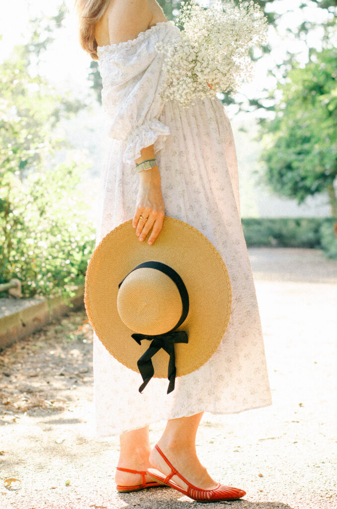 Silhouette of expecting mother in golden afternoon light.