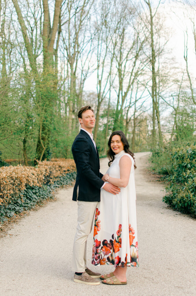 Expecting couple takes a walk around Eramuspark, by the canals.