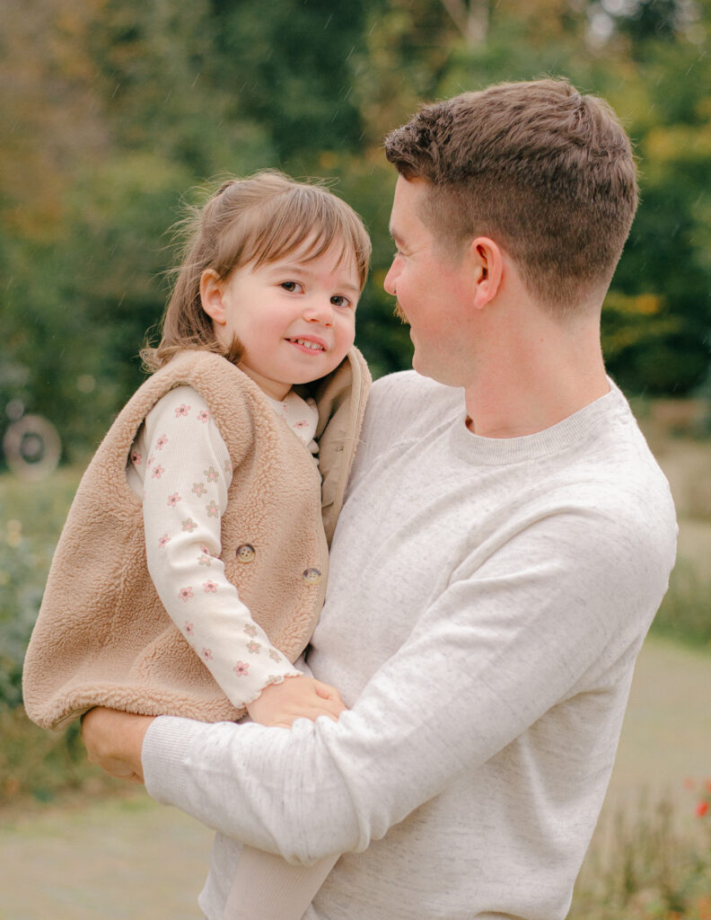 Laughing family candid during a fall session.