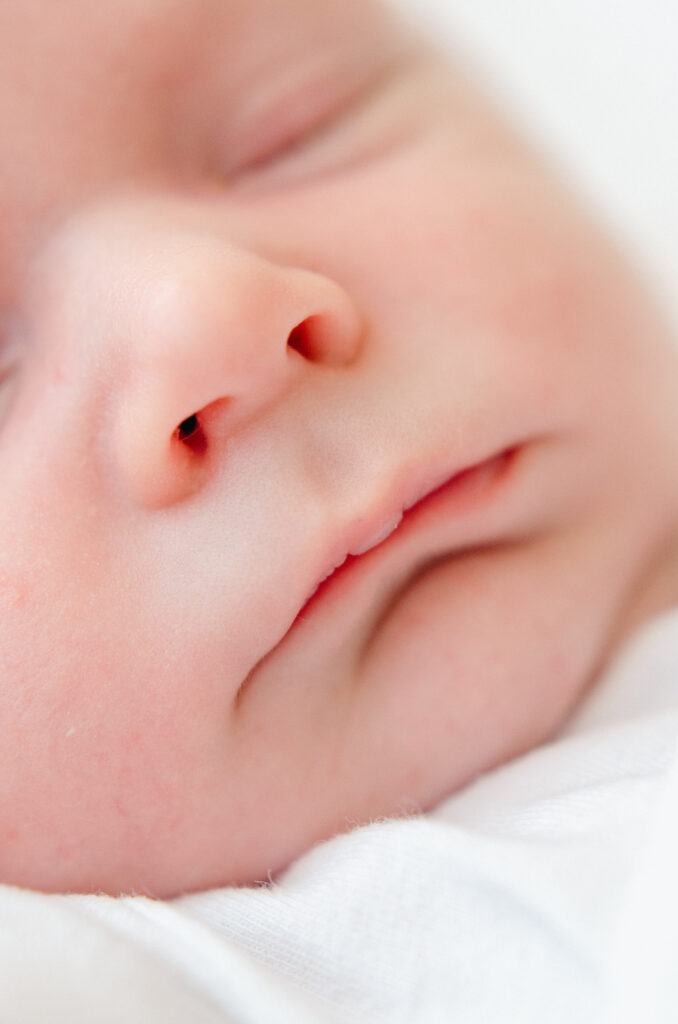 Close up baby's face in natural studio lighting.