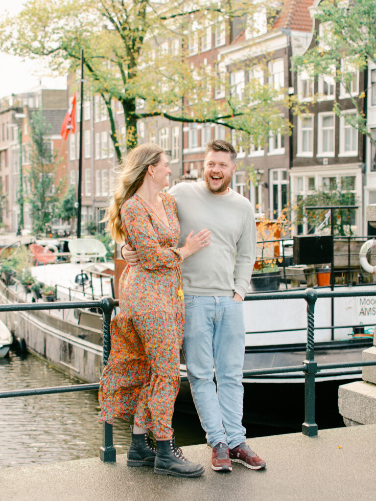 Couple laugh together in the Jordaan district.