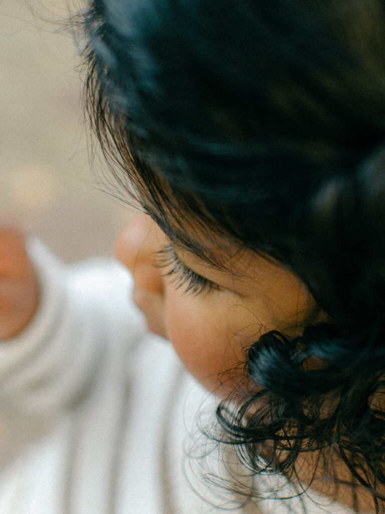Closeup editorial style shot of a toddler girl's long eyelashes.