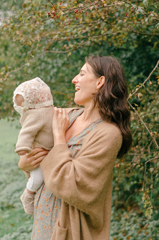 Laughing family candid during a fall session.