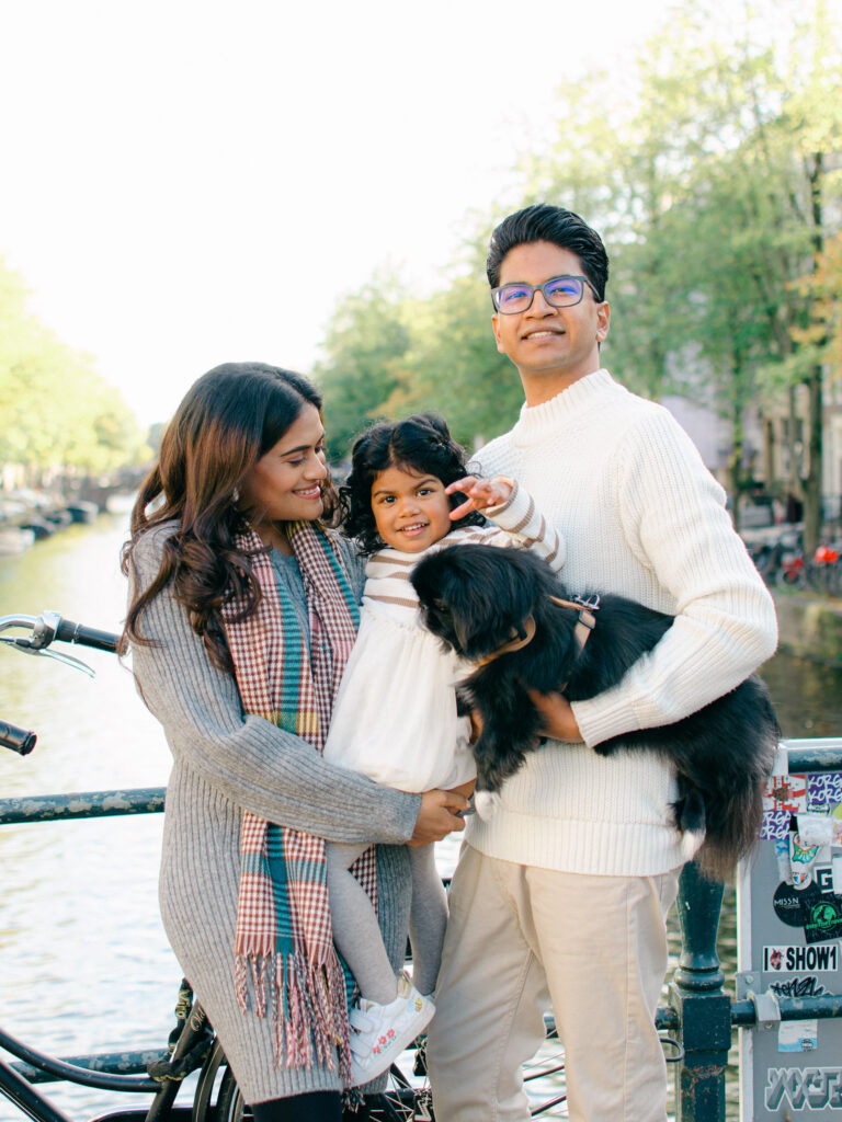 Family walking along Keizersgracht during a sunny fall afternoon.