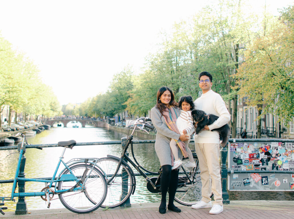 Autumn foliage behind family portraits on Keizersgracht.