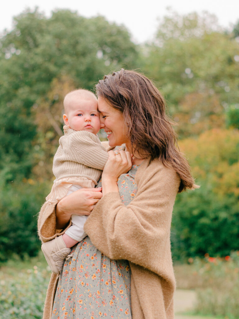 Snuggly moment between mother and infant daughter.