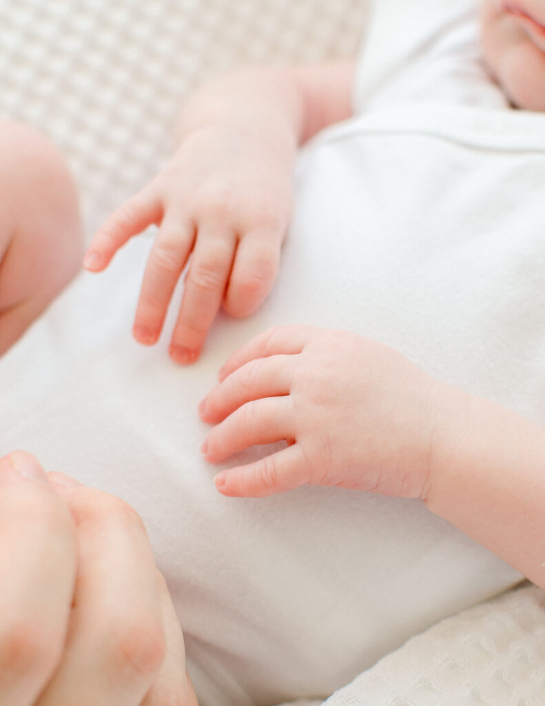 Close up of tiny baby hands during a newborn studio session.