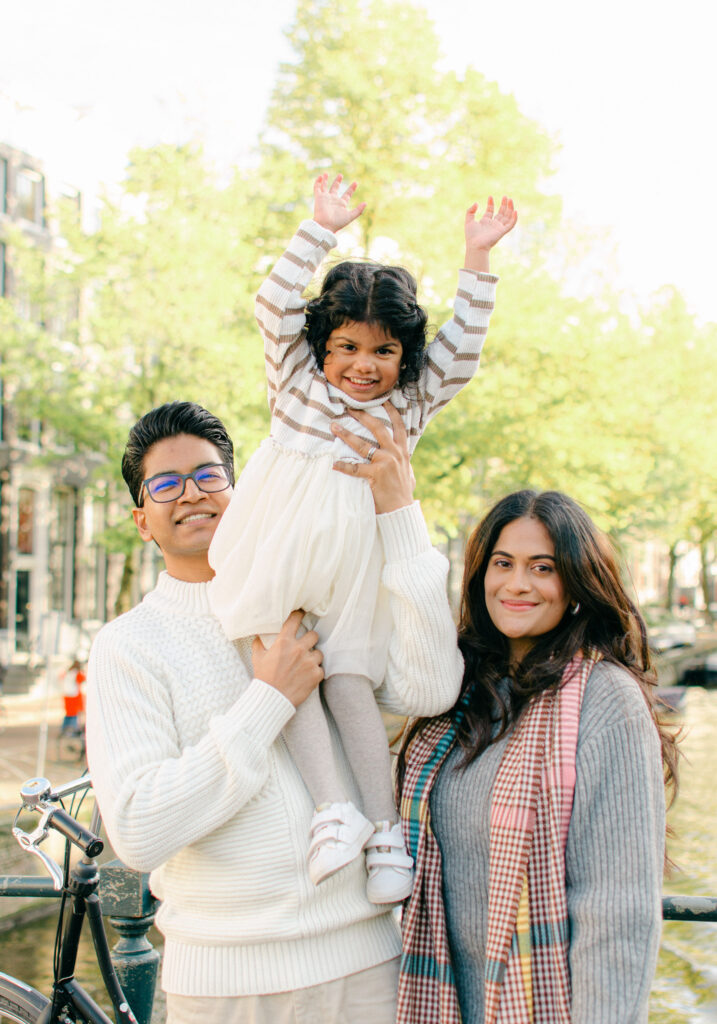 Soft, editorial-style family portrait near Keizersgracht canal.