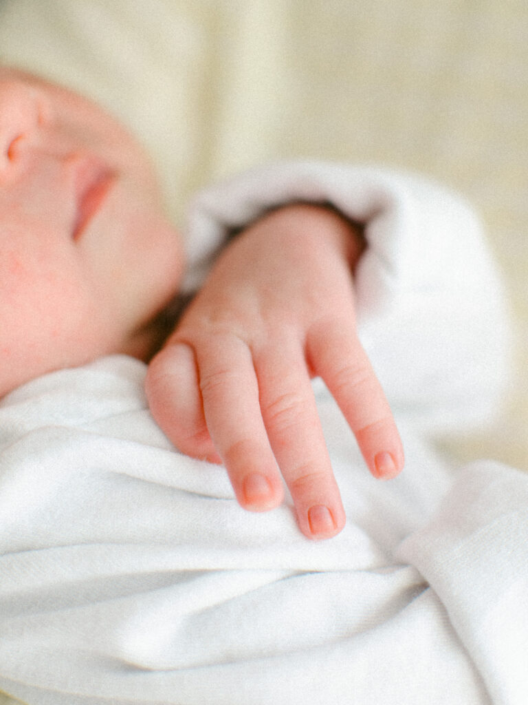 Detail image of newborn baby's hand.